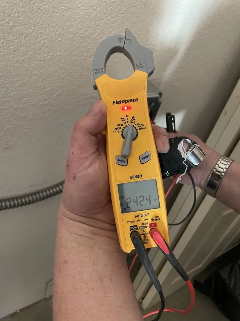 Voltage testing with clamp meter during Hot Tub / Pool Electrical Wiring in Oxford